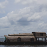 How Do Custom Timber Boat Houses Enhance Lakeside Living?